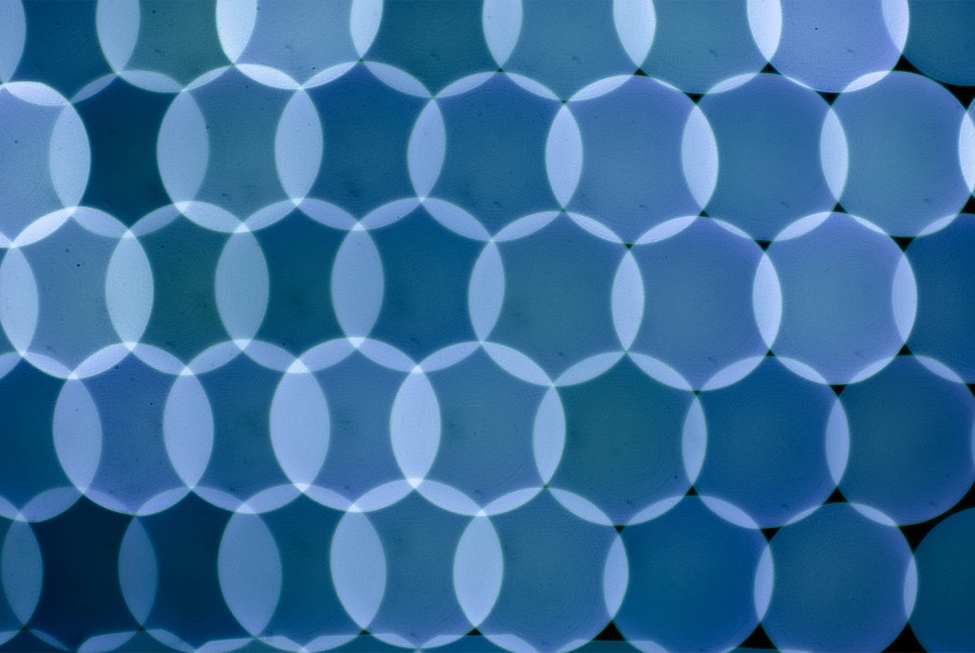 This image shows an abstract blue pattern against a dark background.
